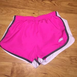 Pink Sketchers running shorts.